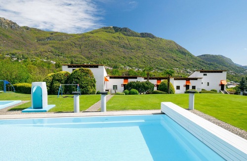 Capriasca Apartment | Cosy apartment for 4 guests with WIFI, pool, TV, patio, pets allowed and panoramic view