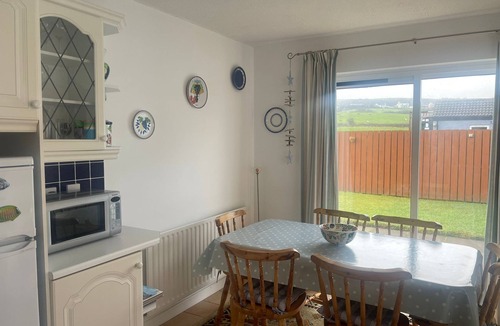Bushmills House | Cosy coastal bungalow in Portballintrae. Five minute drive to portrush.