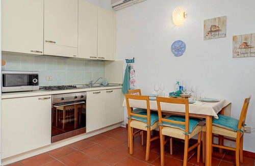 Palau House | Holiday Home 'La Casedda Di Nina' with Sea View, Private Terrace and Air Conditioning