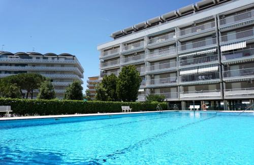 Porto Santa Margherita Apartment | Welcoming flat with pool view balcony