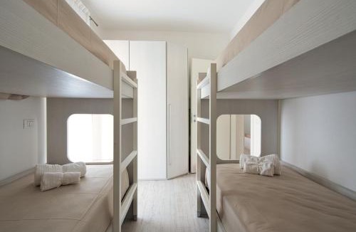 Eraclea Mare Apartment | Oasi moderna con piscina a due passi dal mare