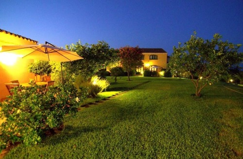 Carruba House | Torre Archirafi Resort -refuge nestled in the green Sicilian countryside.