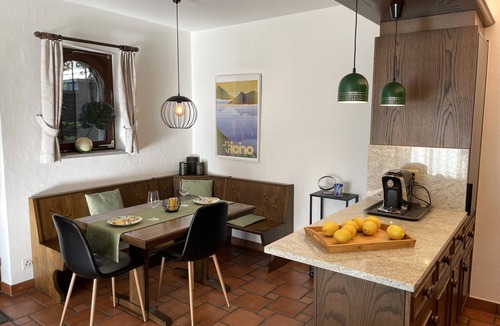 Gordola Apartment | Vacation apartment with panoramic view and outdoor pool, garden seating area and sunbathing lawn