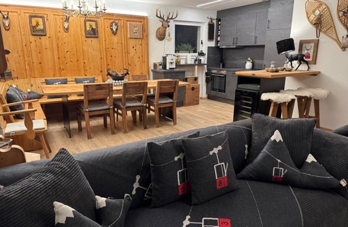 Engadin Scoul House | Vacation home with wellness area in alpine chic retro style