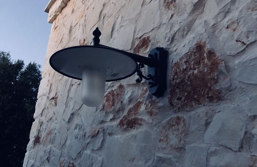Ostuni Villa | White stone typical apulian villa with barrel roof surrounded by olive trees.