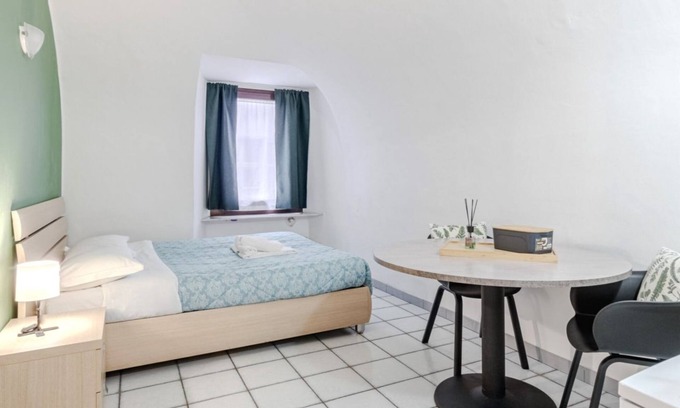 Roman Quarter Apartment | Stylish Studio in Turin's Vibrant Quadrilateral